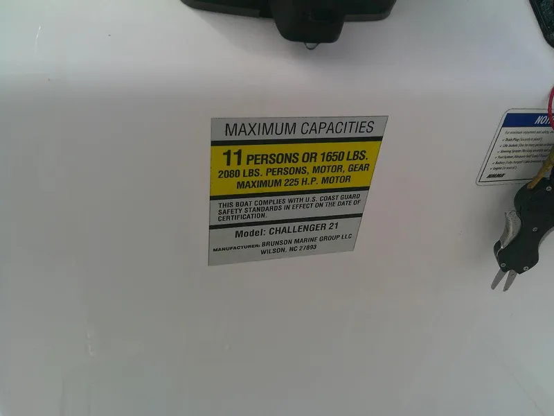 Slide: The Image of KenCraft Challenger 21 boat capacity label, 11 persons or 1650 lbs, 2020 model. - 11