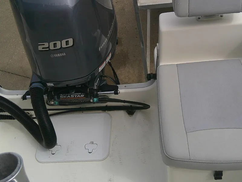 Slide: The Image of KenCraft Challenger 21 boat, 2020 model, featuring a Yamaha 200 outboard motor and seating area. - 12