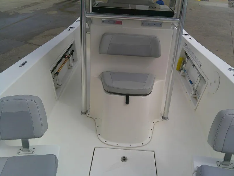 Slide: The Image of KenCraft Challenger 21 boat interior, 2020 model, featuring cushioned seating and storage compartments. - 18