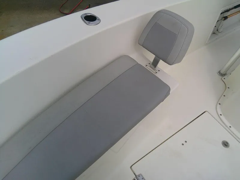 Slide: The Image of KenCraft Challenger 21 2020 boat interior with gray seating and white deck. - 19
