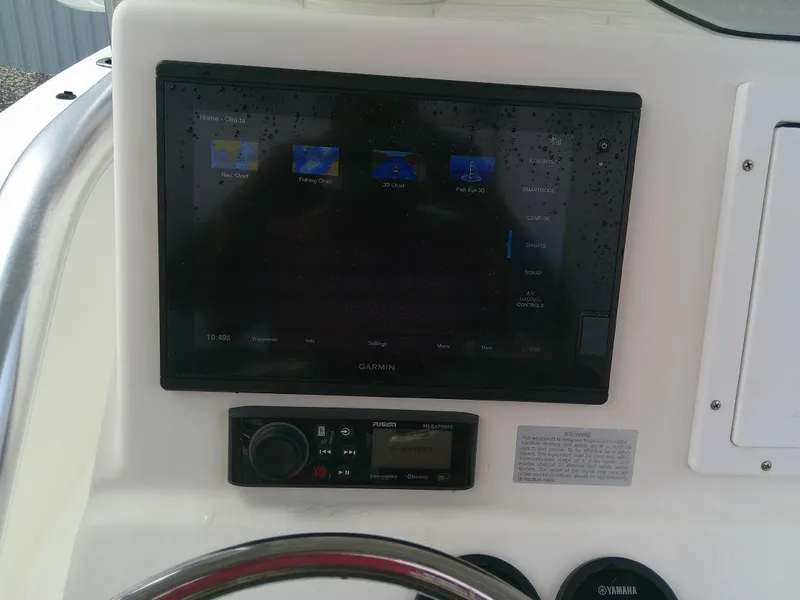 Slide: The Image of KenCraft Challenger 21 2020 boat dashboard with Garmin display and control panel. - 22