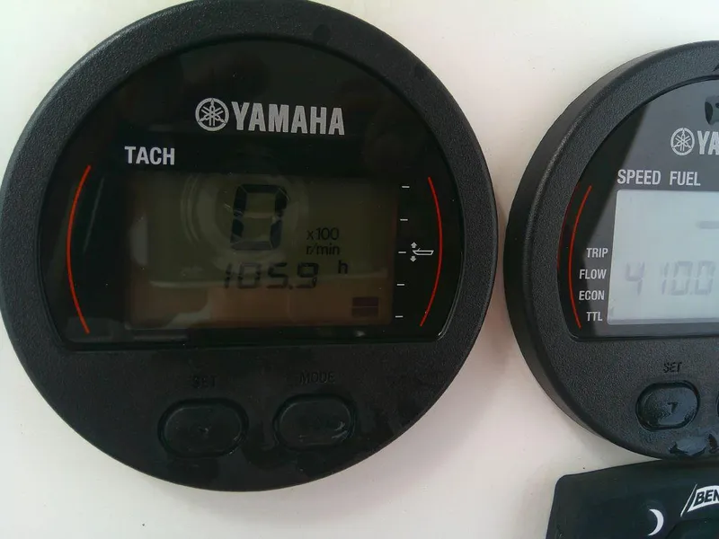 Slide: The Image of Yamaha tachometer and speed fuel gauges on a 2020 KenCraft Challenger 21 boat. - 27
