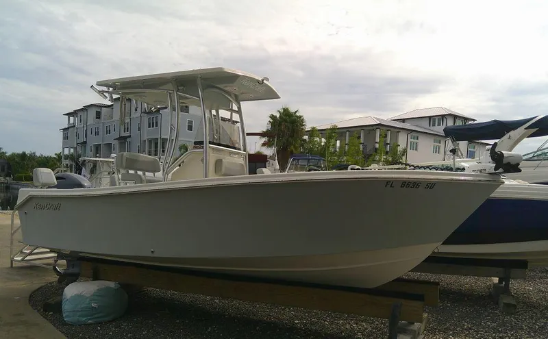 Slide: The Image of 2020 KenCraft Challenger 21 boat docked near waterfront buildings. - 4