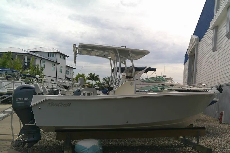 Slide: The Image of KenCraft Challenger 21 boat, 2020 model, docked with Yamaha outboard motor. - 5