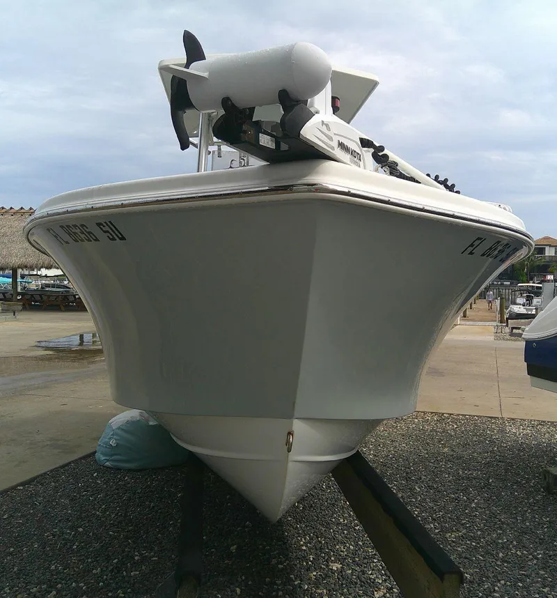 Slide: The Image of 2020 KenCraft Challenger 21 boat on a trailer in a marina. - 6