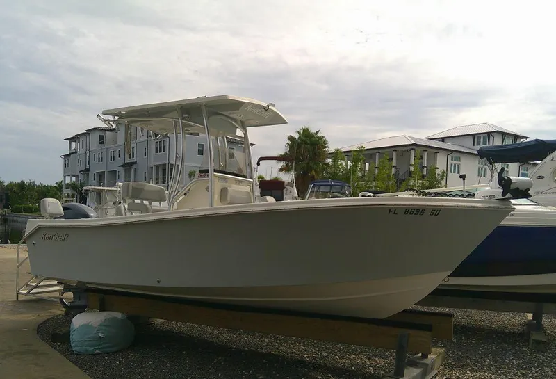 Slide: The Image of 2020 KenCraft Challenger 21 boat docked near modern buildings. - 7