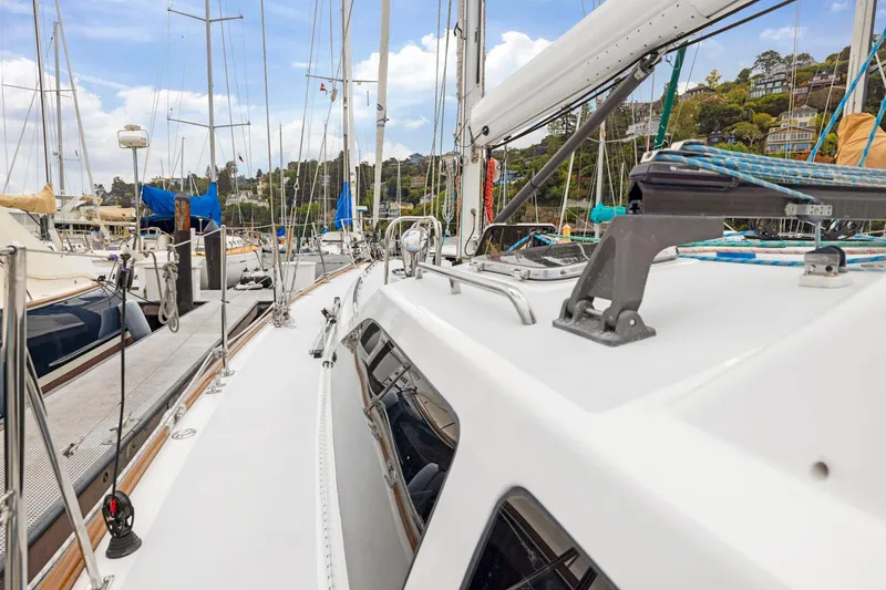 Slide: The Image of Sailboat deck view at marina, Morris 486, 2005 model, surrounded by other boats. - 10