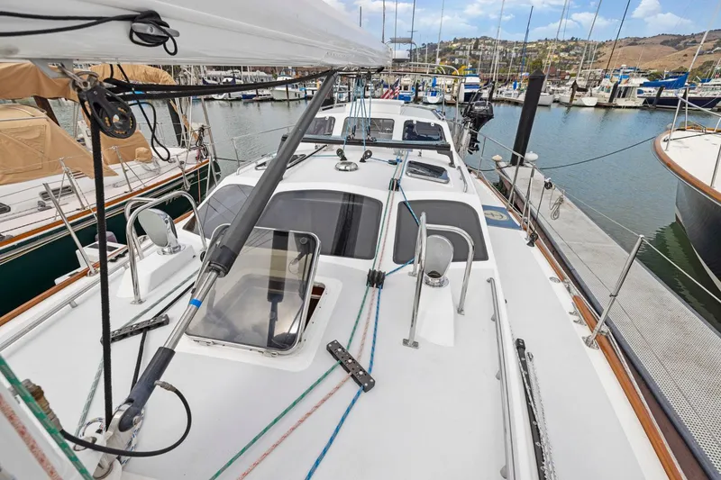 Slide: The Image of Sailboat deck view at marina, Morris 486, 2005 model, surrounded by other boats. - 14