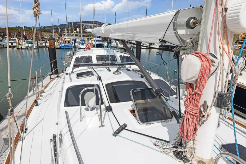Slide: The Image of Sailboat docked in marina, Morris 486, 2005 model, with clear sky and water view. - 19