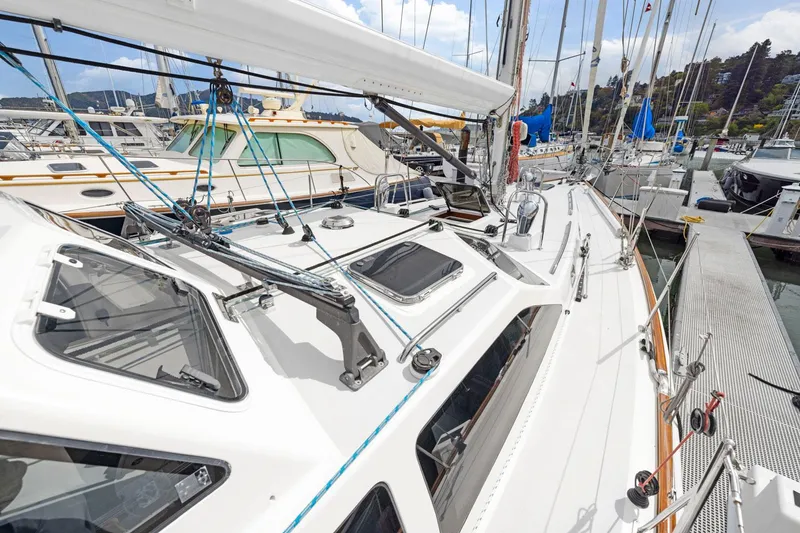 Slide: The Image of Sailboat docked at marina, Morris 486 model, 2005, with visible deck and rigging. - 21