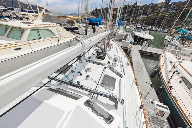 Slide: The Image of Sailboat docked in marina, Morris 486, 2005 model, surrounded by other boats. - 24