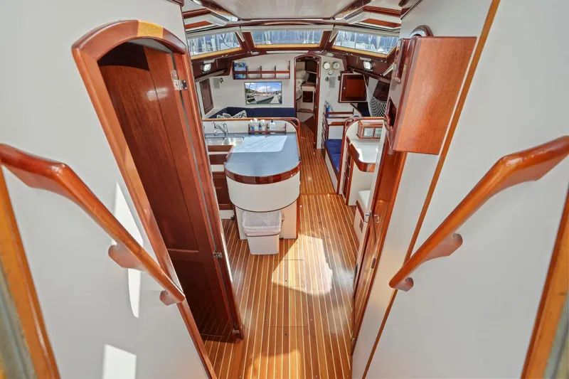 Slide: The Image of Luxurious interior of a 2005 Morris 486 yacht with elegant wood finishes and modern amenities. - 32