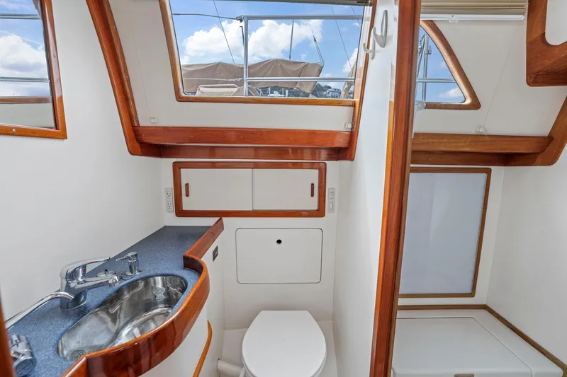 Slide: The Image of Luxurious 2005 Morris 486 yacht bathroom with modern fixtures and wooden accents. - 34