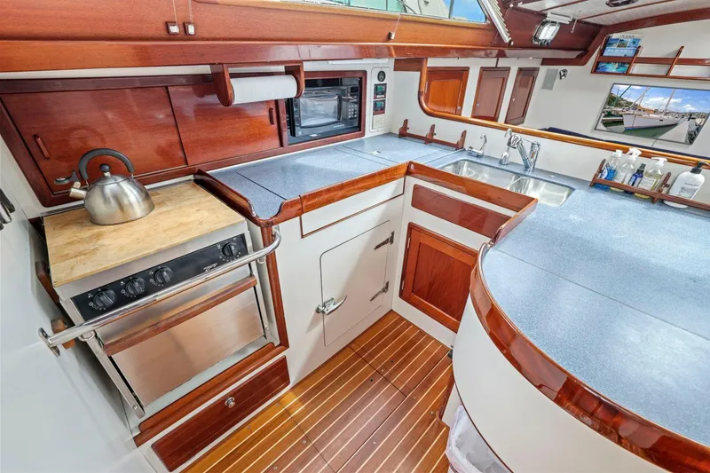 Slide: The Image of Luxurious 2005 Morris 486 yacht kitchen with wood accents and modern appliances. - 36