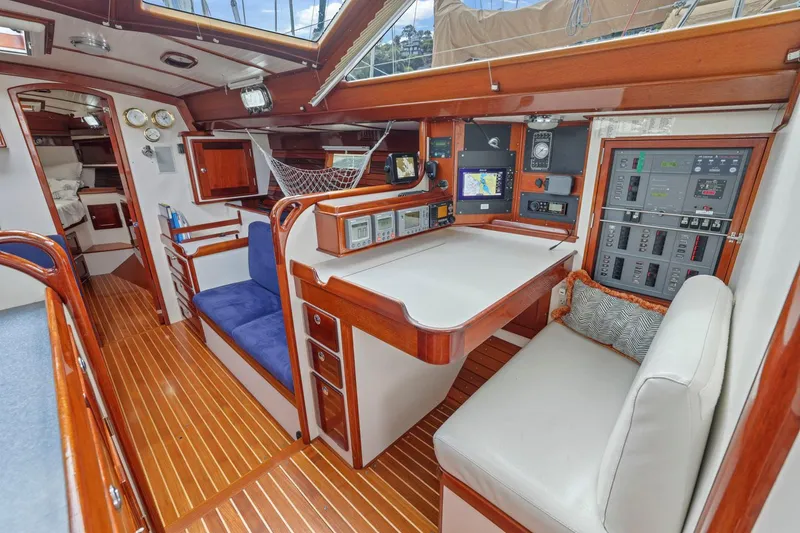 Slide: The Image of Luxurious Morris 486 yacht interior, featuring navigation station and seating, 2005 model. - 37