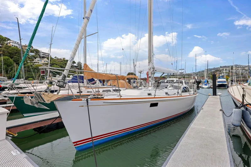 Slide: The Image of Sailboat docked in marina, Morris 486 model, 2005, with clear blue sky background. - 4