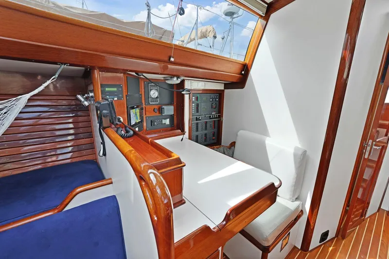 Slide: The Image of Interior of a 2005 Morris 486 sailboat with wooden finishes and navigation equipment. - 40