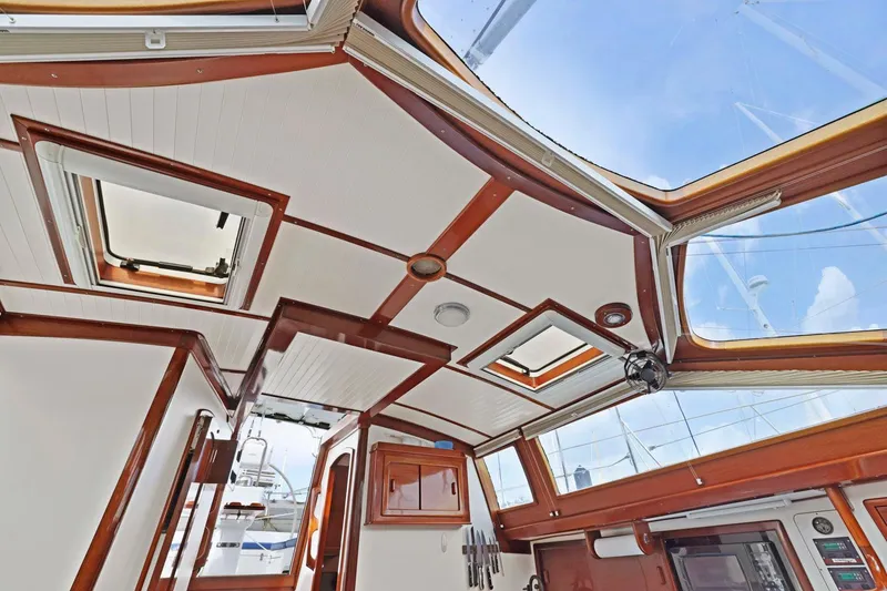Slide: The Image of Interior view of a 2005 Morris 486 yacht with wooden accents and skylights. - 45