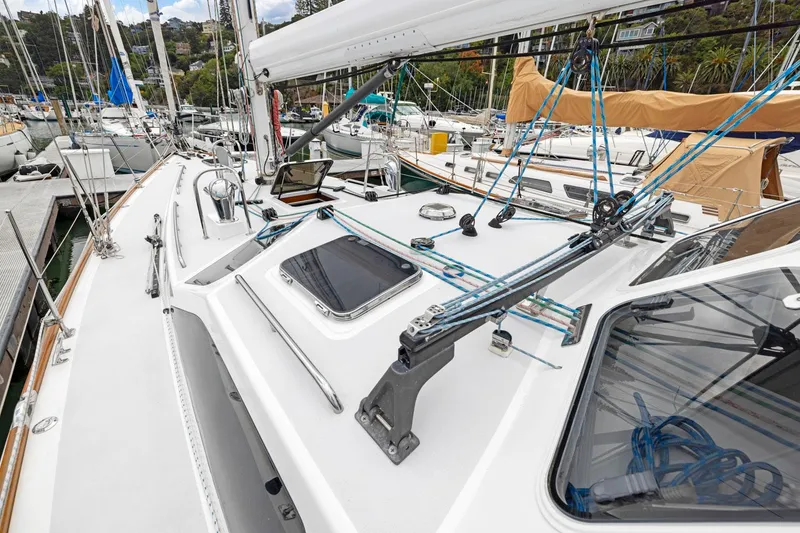 Slide: The Image of Sailboat deck view, Morris 486, 2005 model, docked in marina with rigging and equipment. - 8