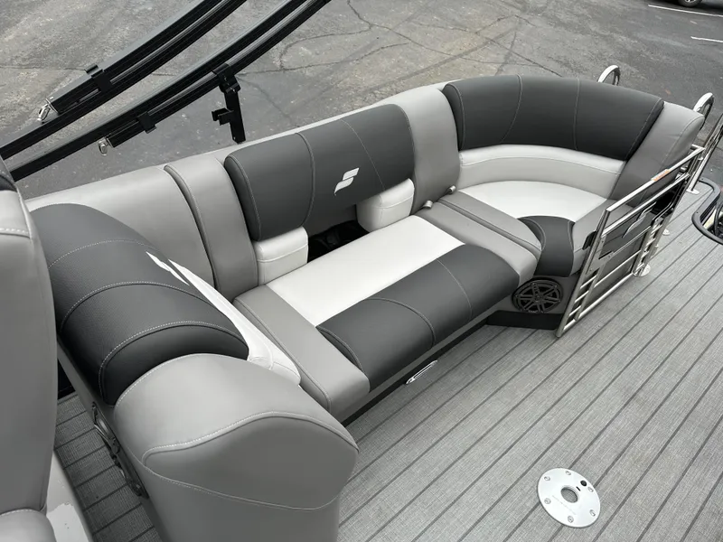 Slide: The Image of 2024 Starcraft MX 25 R boat interior with gray and black seating. - 10