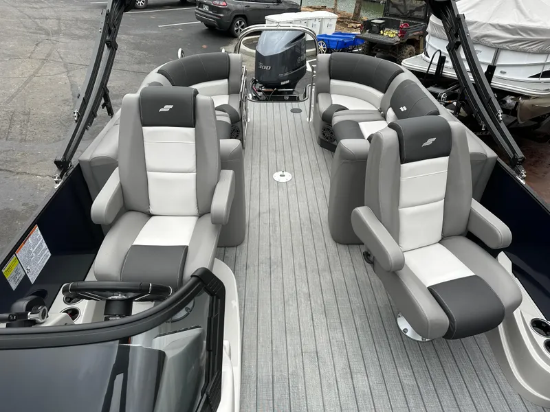 Slide: The Image of 2024 Starcraft MX 25 R pontoon boat interior with luxurious seating. - 15