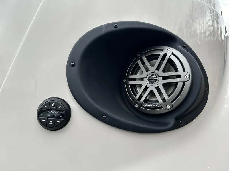 Slide: The Image of 2024 Starcraft MX 25 R boat speaker and control panel close-up. - 16
