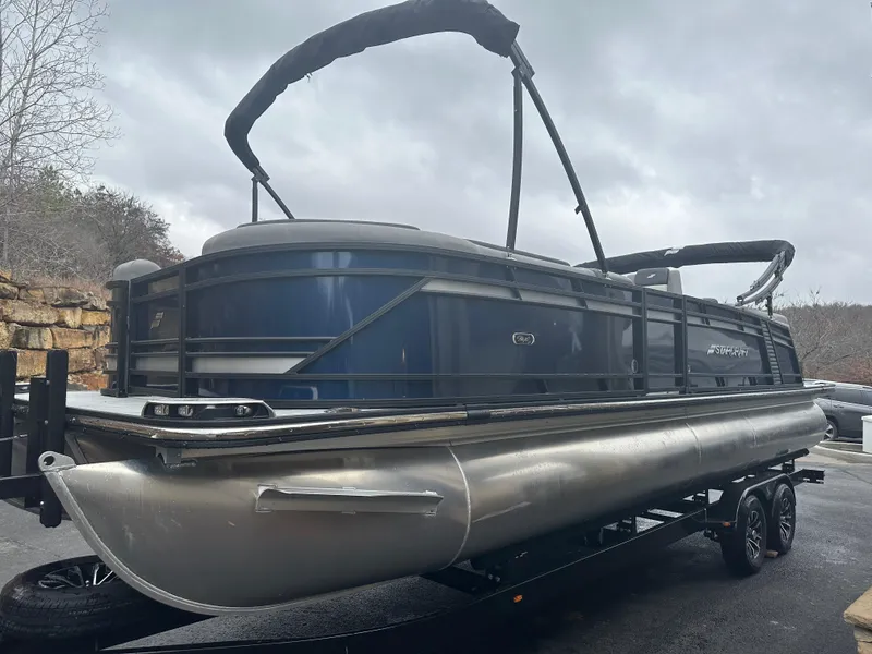Slide: The Image of 2024 Starcraft MX 25 R pontoon boat on a trailer. - 3