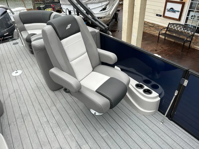 Slide: The Image of 2024 Starcraft MX 25 R boat interior with luxurious seating and cup holders. - 9