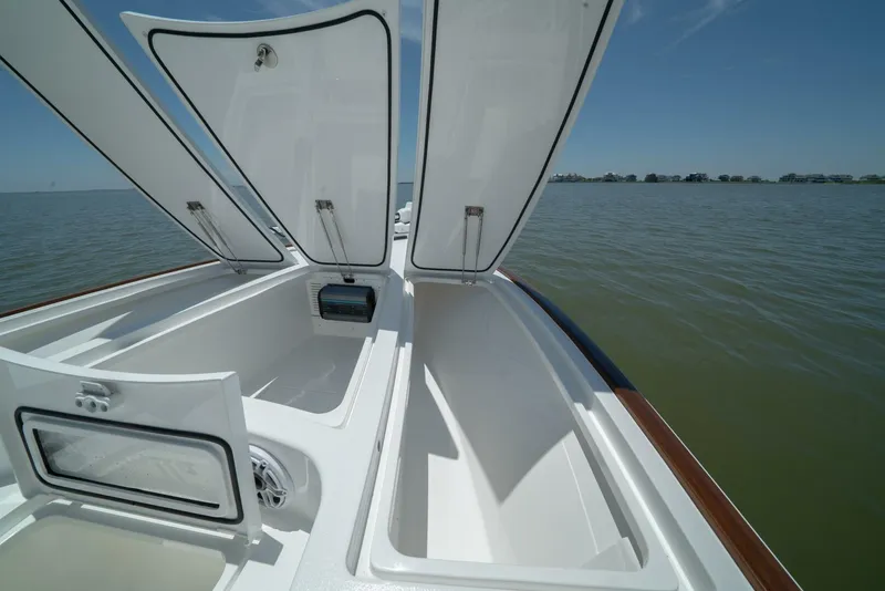 Slide: The Image of 2024 Valhalla Boatworks V-28 open storage compartments on deck. - 18