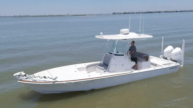Slide: The Image of 2024 Valhalla Boatworks V-28 on calm waters with a person at the helm. - 33