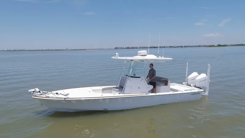 Slide: The Image of 2024 Valhalla Boatworks V-28 on calm waters with a person at the helm. - 35
