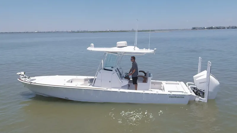 Slide: The Image of 2024 Valhalla Boatworks V-28 center console boat on calm water. - 38
