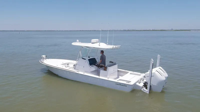 Slide: The Image of 2024 Valhalla Boatworks V-28 center console boat on calm water. - 39