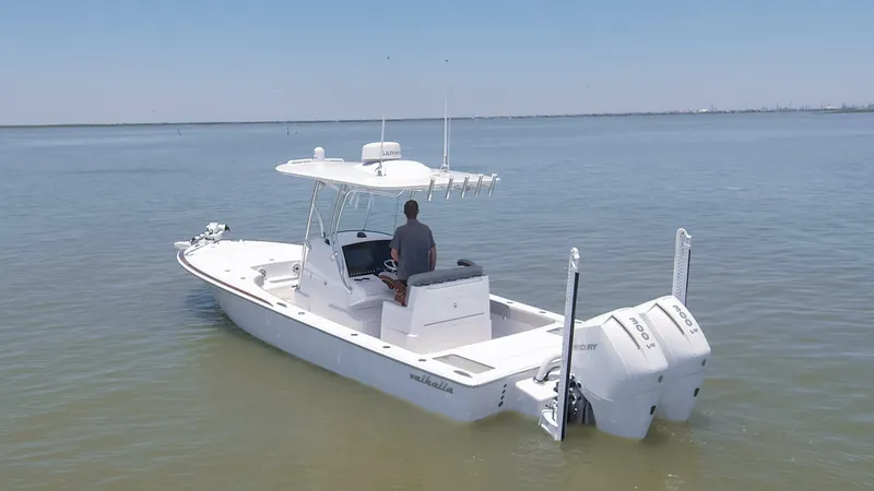Slide: The Image of 2024 Valhalla Boatworks V-28 center console boat on calm water. - 41