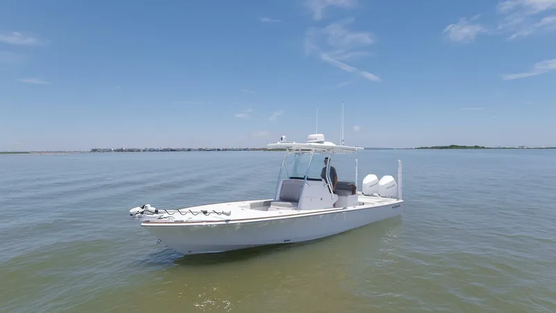 Slide: The Image of 2024 Valhalla Boatworks V-28 on calm waters under a clear blue sky. - 46