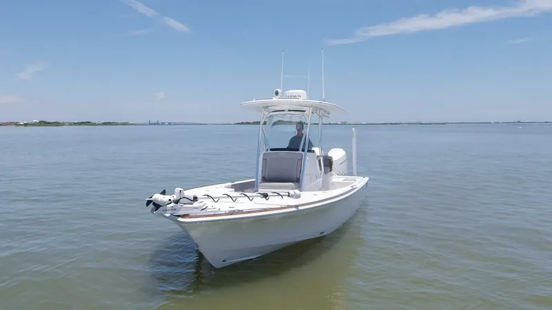 Slide: The Image of 2024 Valhalla Boatworks V-28 on calm waters under a clear blue sky. - 47