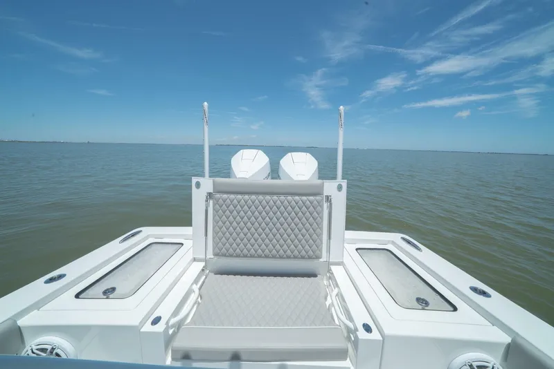 Slide: The Image of 2024 Valhalla Boatworks V-28 rear deck with twin engines on open water. - 8