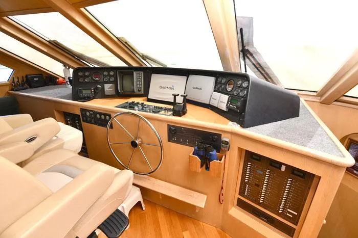 Slide: The Image of Pilothouse interior of 1997 Forbes Cooper 74, featuring navigation equipment and steering wheel. - 13