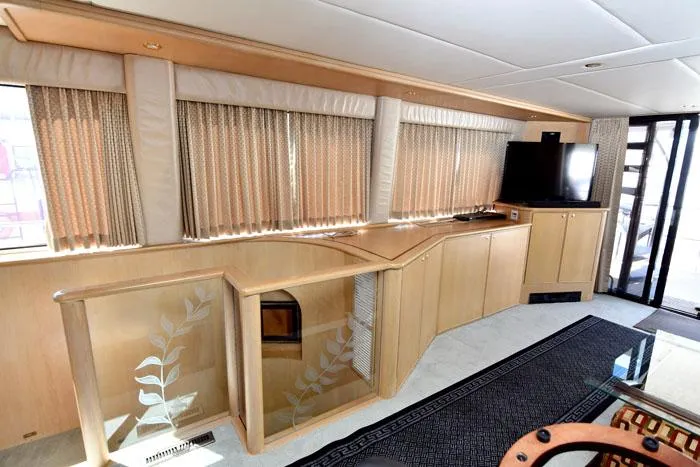 Slide: The Image of Luxurious interior of 1997 Forbes Cooper 74 Pilothouse yacht with elegant wood finishes. - 16
