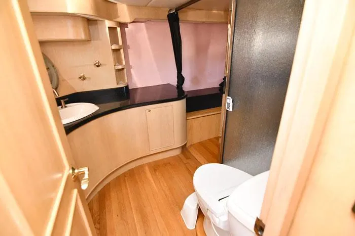 Slide: The Image of Luxurious bathroom in 1997 Forbes Cooper 74 Pilothouse yacht with modern amenities. - 24