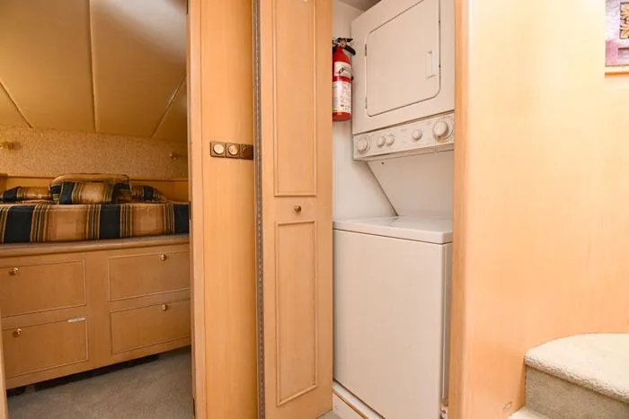 Slide: The Image of Laundry area and bedroom in 1997 Forbes Cooper 74 Pilothouse yacht interior. - 26