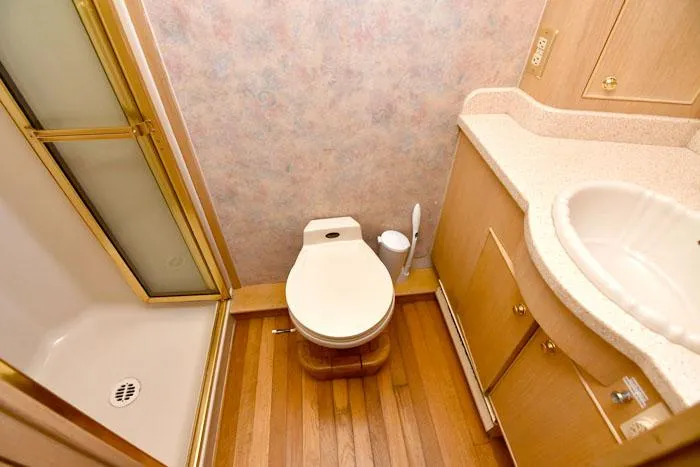 Slide: The Image of Bathroom interior of 1997 Forbes Cooper 74 Pilothouse yacht with shower and wooden flooring. - 33