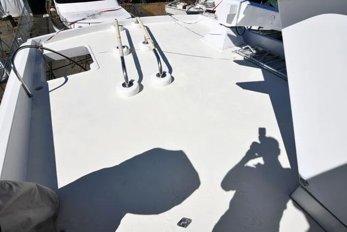 Slide: The Image of Deck of 1997 Forbes Cooper 74 Pilothouse yacht with visible equipment and shadows. - 36