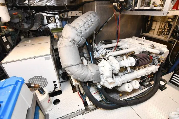 Slide: The Image of Engine room of 1997 Forbes Cooper 74 Pilothouse yacht, showcasing machinery and components. - 39