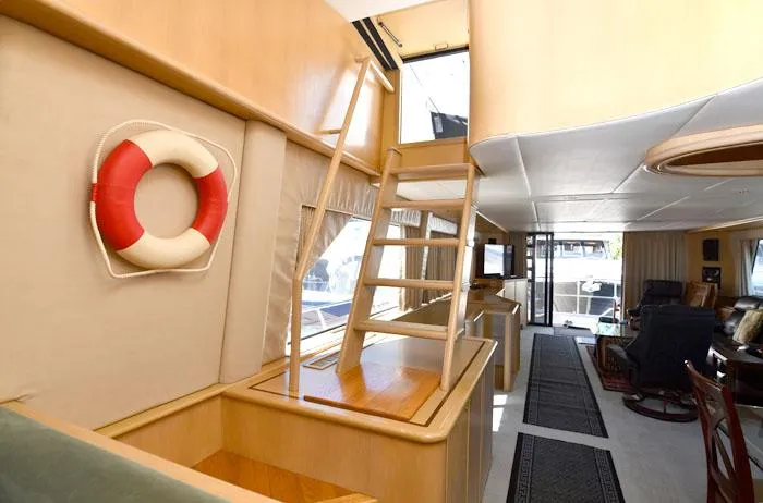 Slide: The Image of Interior of 1997 Forbes Cooper 74 Pilothouse yacht with wooden ladder and life preserver. - 8