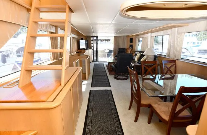 Slide: The Image of Luxurious interior of a 1997 Forbes Cooper 74 Pilothouse yacht with elegant dining area. - 9