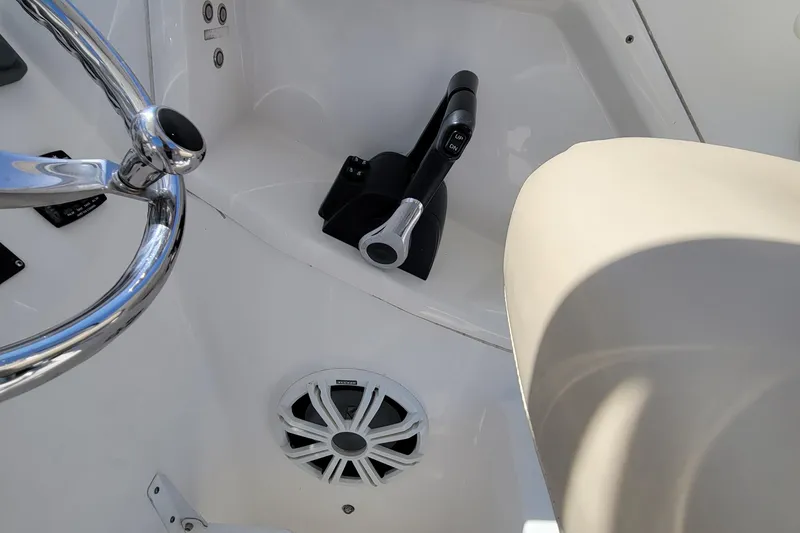 Slide: The Image of Close-up of the helm controls on a 2018 Sea Fox 256 Voyager boat. - 10
