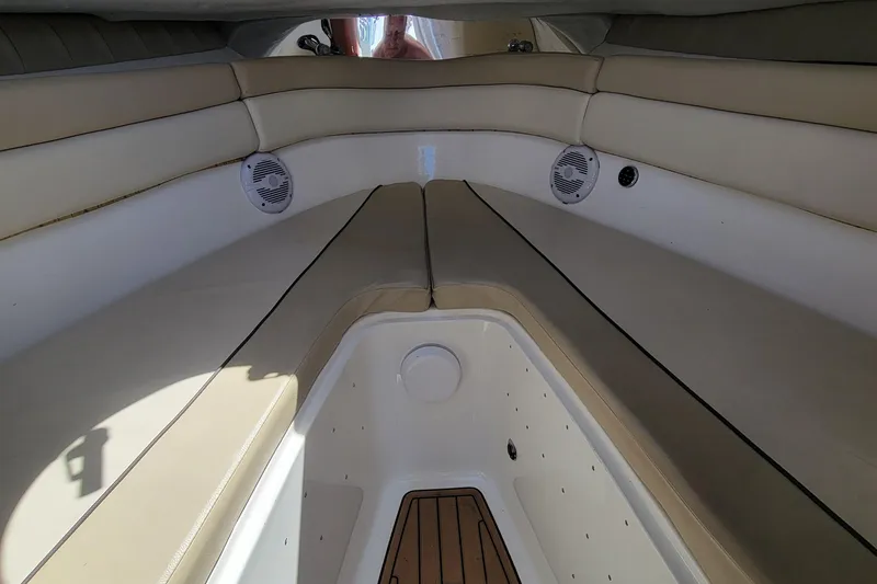Slide: The Image of Interior seating of 2018 Sea Fox 256 Voyager boat with beige cushions and built-in speakers. - 11