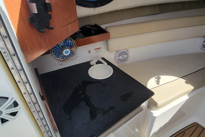 Slide: The Image of Interior of 2018 Sea Fox 256 Voyager boat with sink and seating area. - 13