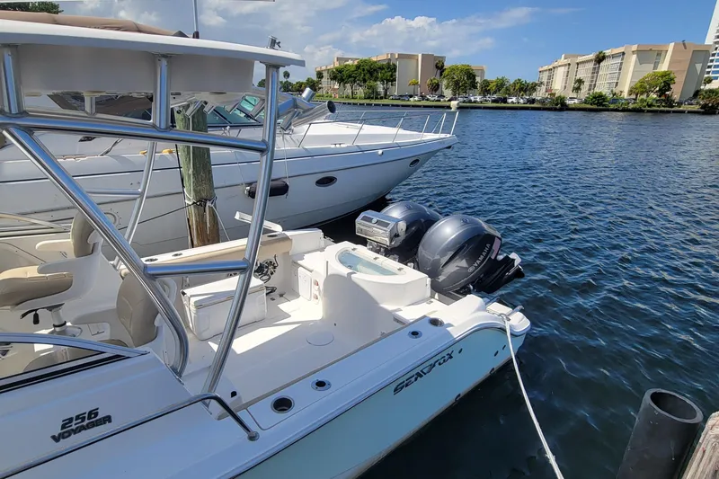 Slide: The Image of 2018 Sea Fox 256 Voyager docked at marina with twin outboard engines. - 3